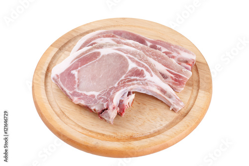 Raw pork chop on wooden broad or cooking pork chop steak..