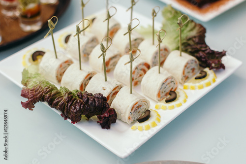 Lavash rolls stuffed with salmon, cheese and sauce.