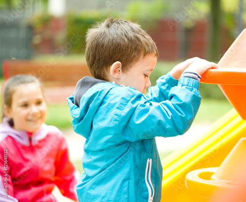 Little boy is playing on playground