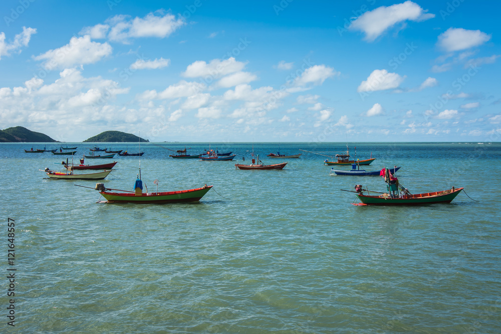 Fishing boats in the sea and a beautiful sky at The  Chao Lao Beach,  Chanthaburi, Thailand.