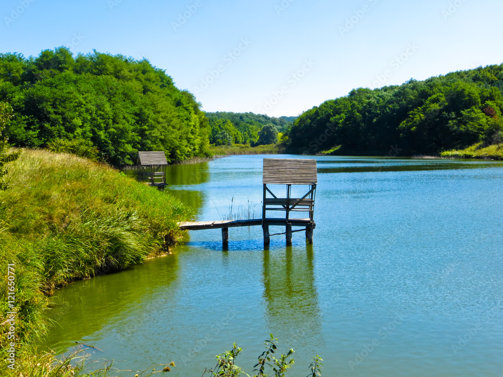 Wooden place for fishing on a lake Wooden place for fishing on a lake