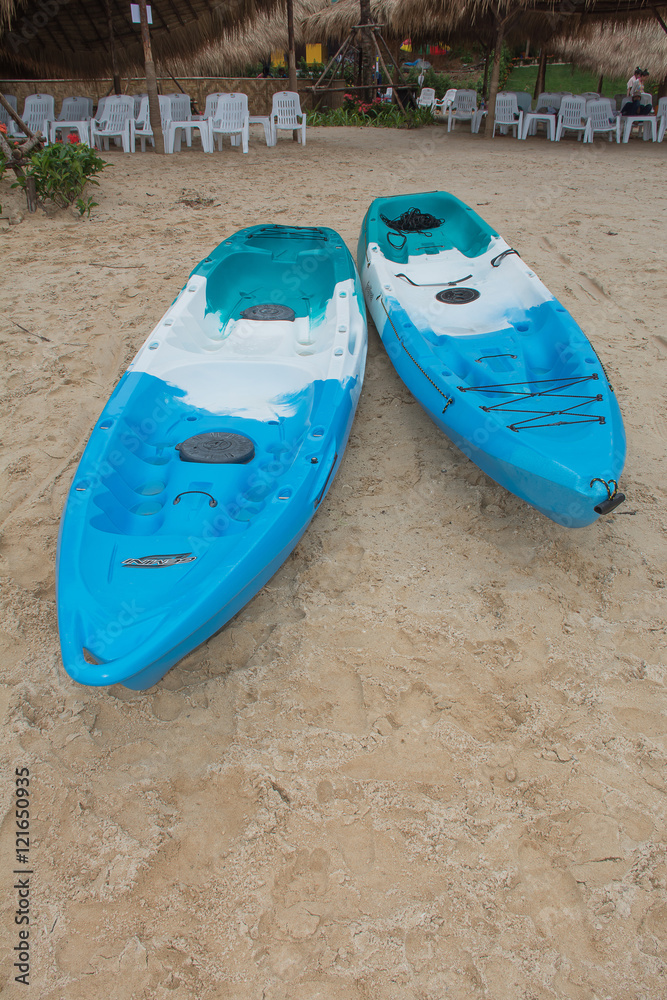 PHUKET,THAILAND - AUGUST 14: Red kayaks anchor at Naka Yai Island at the beach on August 14, 2016 in Phuket, Thailand. PHUKET,THAILAND - AUGUST 14: Red kayaks anchor at Naka Yai Island at the beach on August 14, 2016 in Phuket, Thailand.