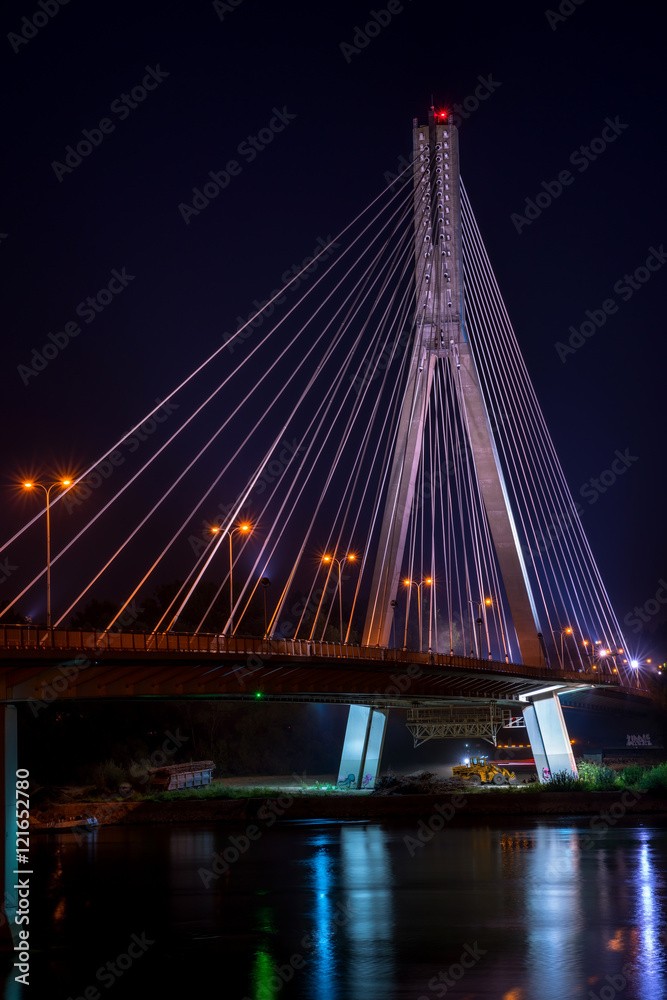 Night view of Swietokrzyski cable-stayed bridge in Warsaw, Poland