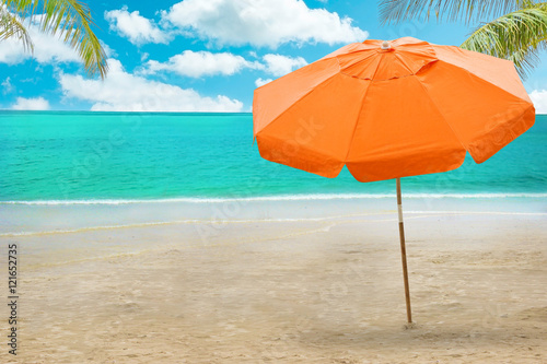 
Chaise lounge and umbrella on beach