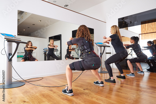 Принти на полотні EMS electro stimulation women exercises
