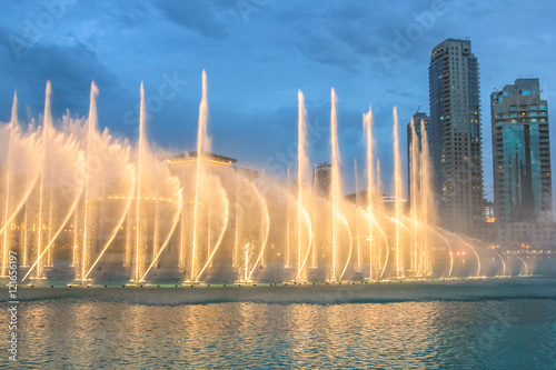 Night view of the light show at Dubai Dancing Fountain. The Dubai Fountain  the world largest choreographed fountain on Burj Khalifa Lake area  performs to the beat of the selected music.