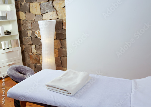 Massage room with massage table photo