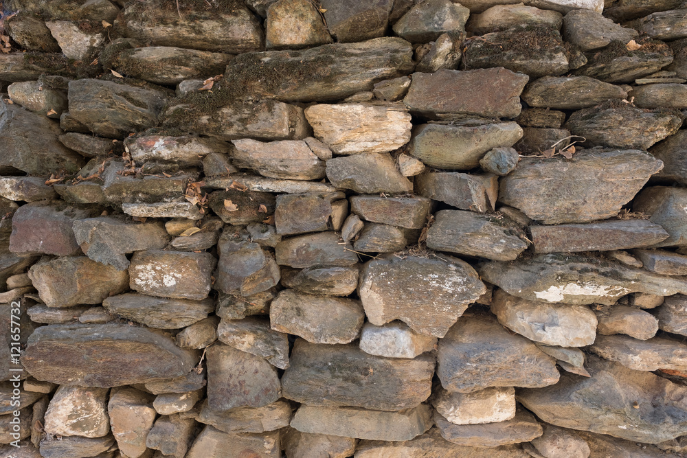 Fototapeta premium Pile of dark stone wall texture