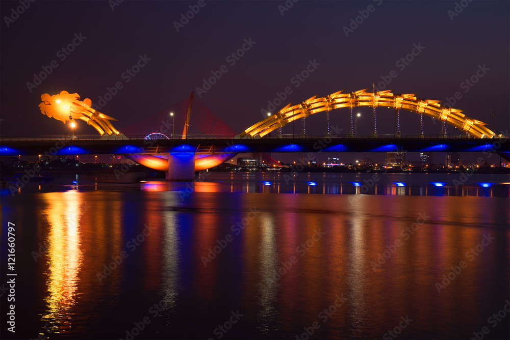 Fototapeta premium The Dragon Bridge of night illumination on Han river. Danang, Vietnam