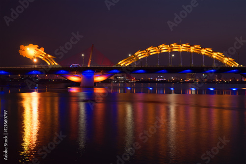 The Dragon Bridge of night illumination on Han river. Danang, Vietnam