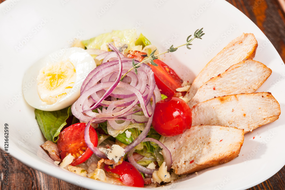 chicken breast salad with cherry tomatoes and egg