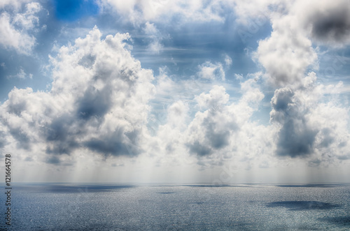 Beautiful autumn clouds in the sky over the sea. HDR photo