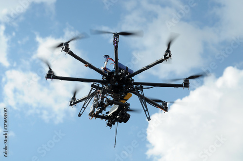 octocopter drone with digital camera in flight, used toning of the photo photo