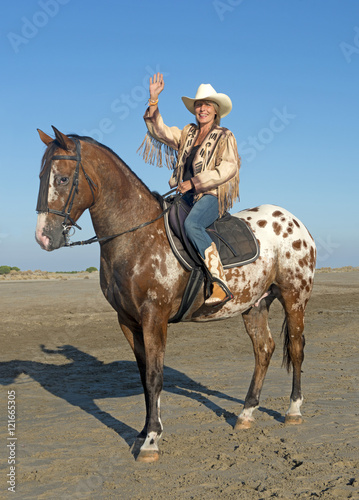 cowgirl on appaloosa horse © cynoclub