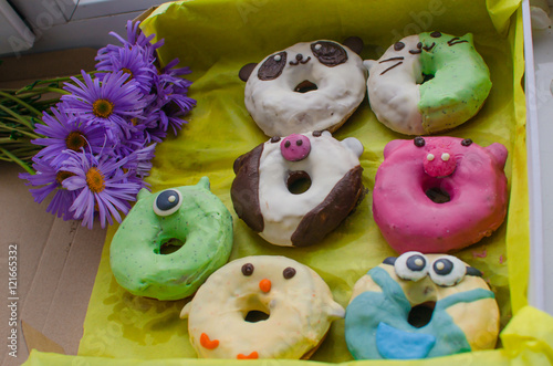 donuts in the form of animals. Multi-colored donuts. Sweets. Box of donuts