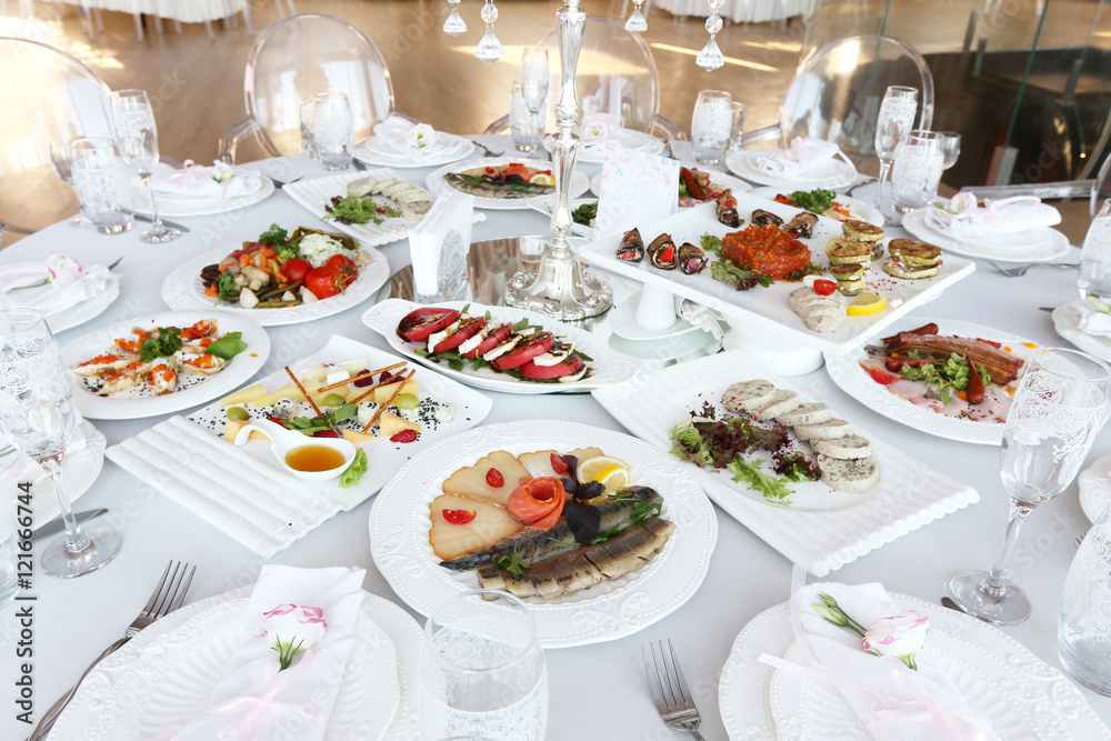 banquet table with dishes in restaurant