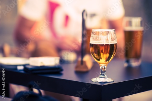 Glass of Beer on a Table photo