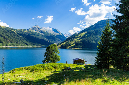 Fototapeta Naklejka Na Ścianę i Meble -  Colorful summer morning on the Speicher Durlassboden lake. View of Richterspitze mountain range in the Austrian Alps. Austria, Europe.