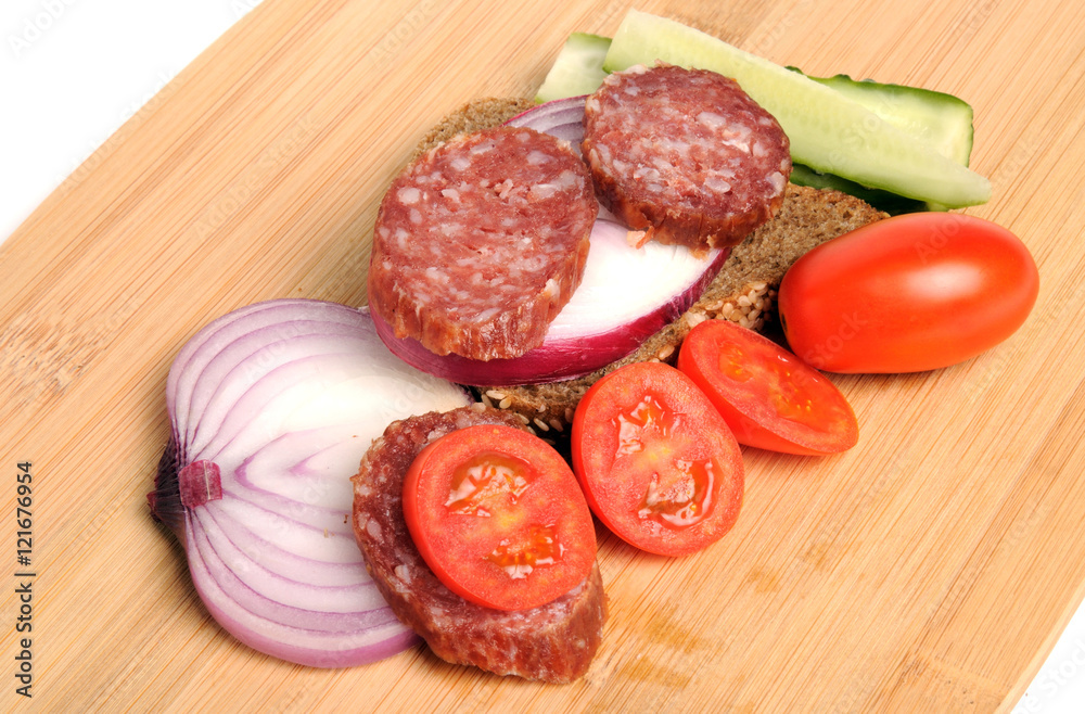summer sausage , salted cucumber, red cherry tomatoes and sliced red onion Bamboo cutting board , traditional snack while drinking vodka summer sausage , salted cucumber, red cherry tomatoes and sliced red onion Bamboo cutting board , traditional snack while drinking vodka