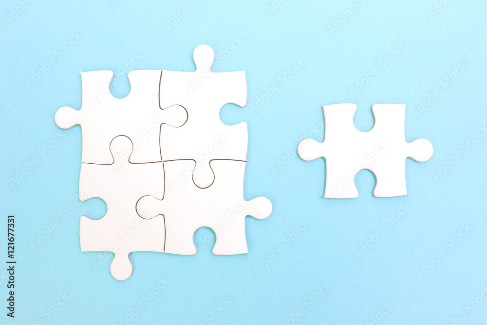 Group of puzzle and a puzzle piece. Teamwork concept. Think difference concept. Leadership concept. Group of puzzle and a puzzle piece. Teamwork concept. Think difference concept. Leadership concept.