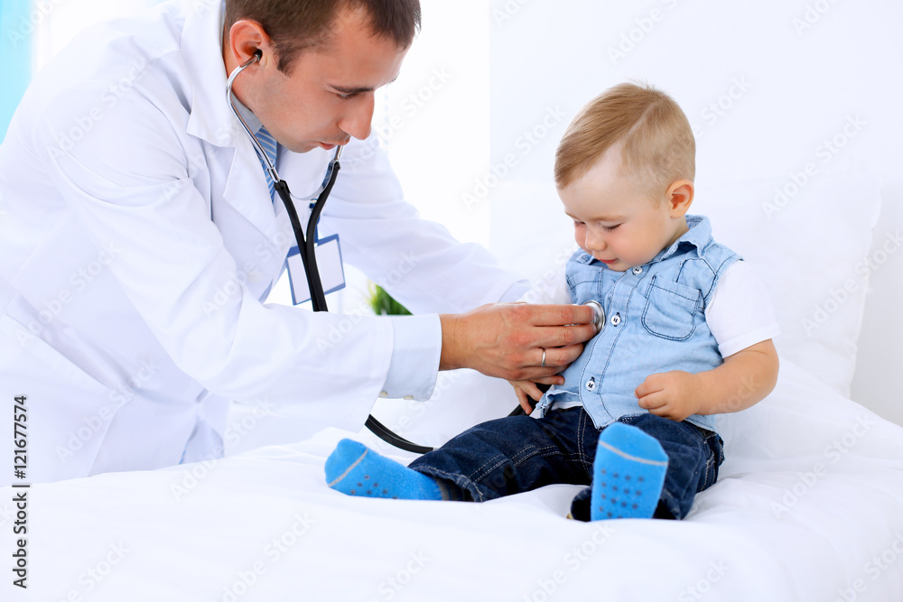 Doctor examining a child patient by stethoscope Doctor examining a child patient by stethoscope