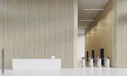 Reception and turnstiles in office with wood walls