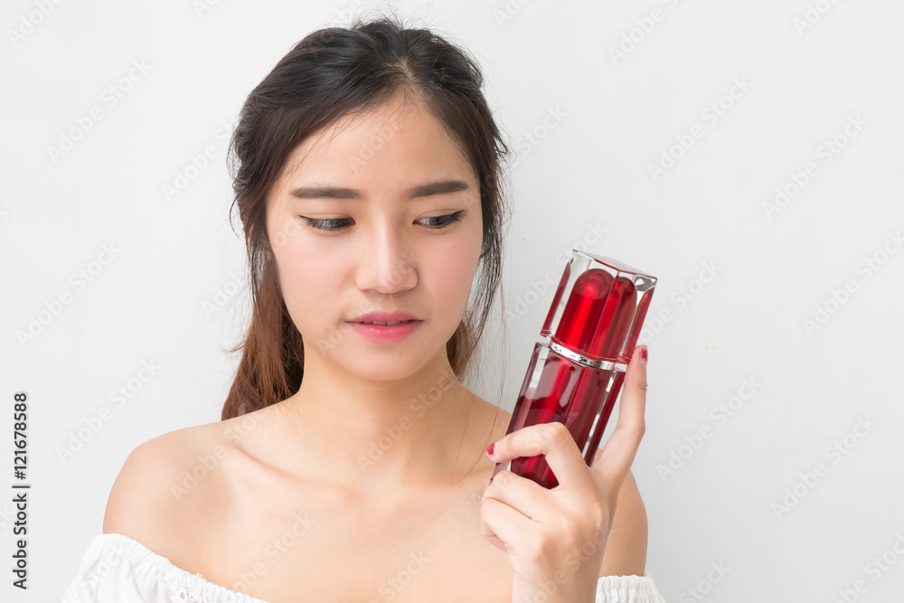 beautiful woman applying cosmetic cream,solated with clipping pa beautiful woman applying cosmetic cream,solated with clipping pa