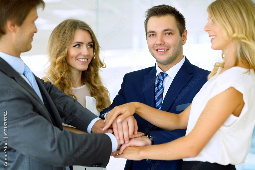 Business people group joining hands and representing concept of friendship and teamwork Business people group joining hands and representing concept of friendship and teamwork
