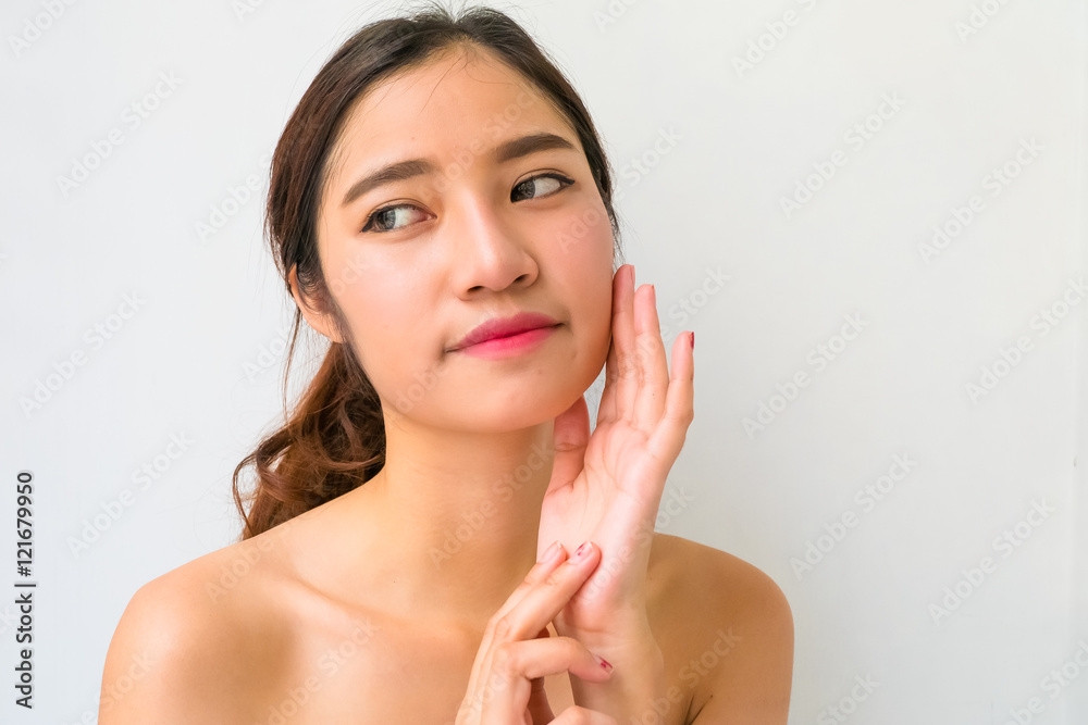 The Portrait of a beautiful female model on white background The Portrait of a beautiful female model on white background