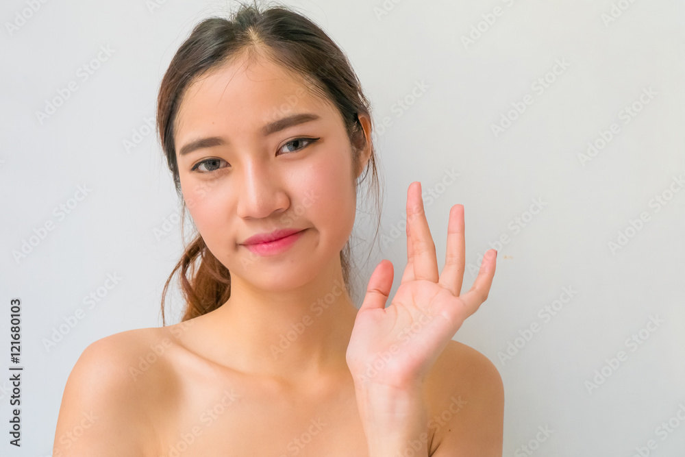 The Portrait of a beautiful female model on white background The Portrait of a beautiful female model on white background