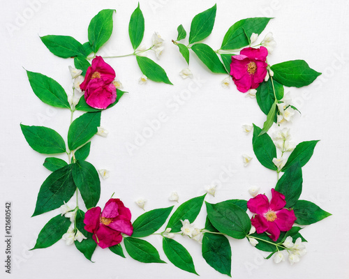 Wreath of pink tea roses and jasmine flowers and leaves