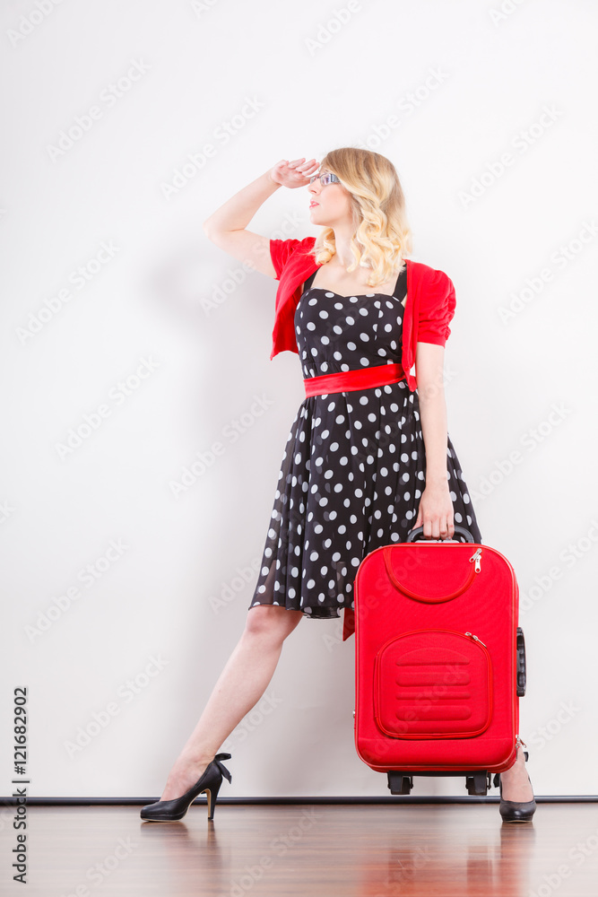 Elegant fashion woman with red suitcase Elegant fashion woman with red suitcase