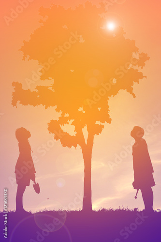 Silhouette children on sunset . concept save the world