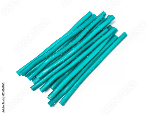 Sweet jelly licorice candy sticks in turquoise, isolated on white background