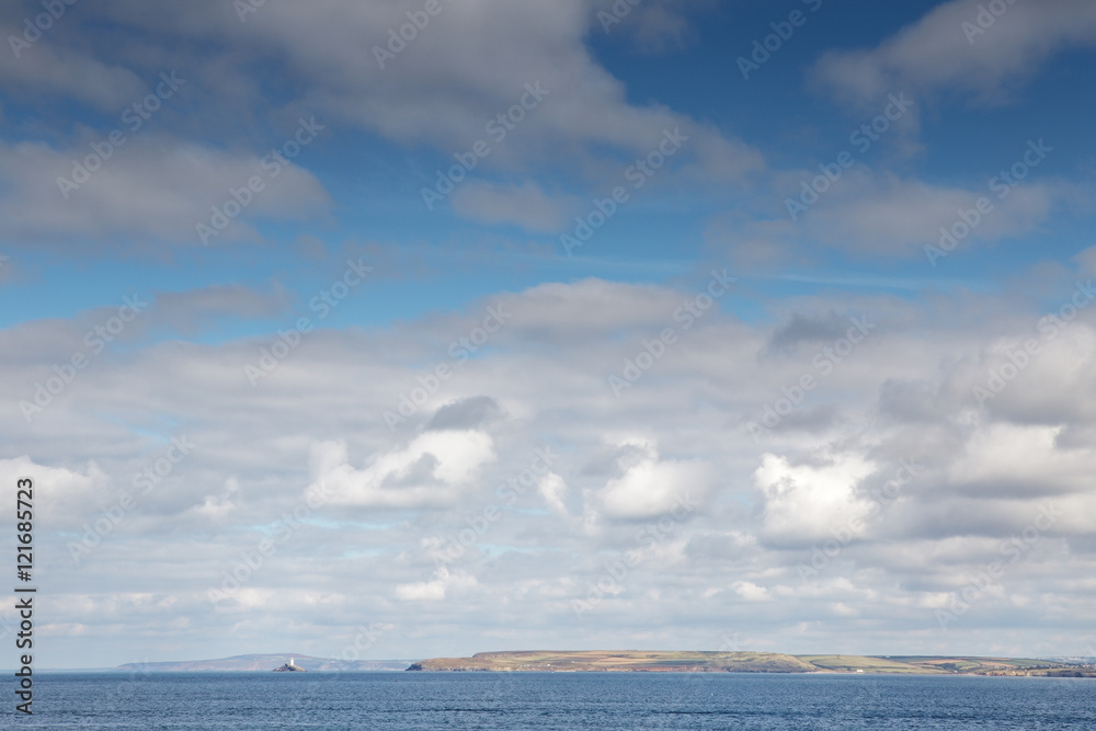 Obraz premium white fluffy clouds down by the sea