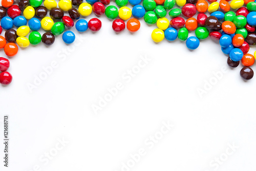 Top right frame of colorful chocolate coated candy on white background,copy space.