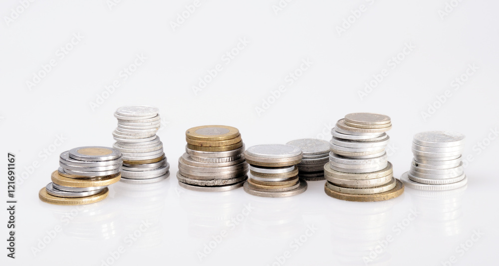 columns of coins from different countries on a white background columns of coins from different countries on a white background
