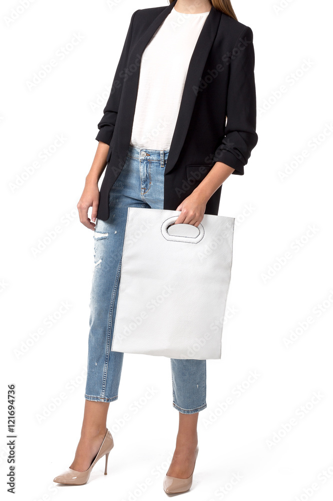 Woman holding a handbag isolated on white background Woman holding a handbag isolated on white background
