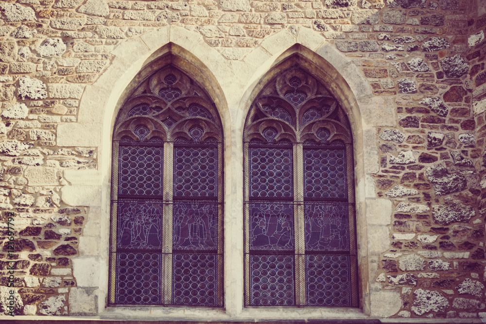 Obraz premium two gothic symmetrical windows with vintage treatment