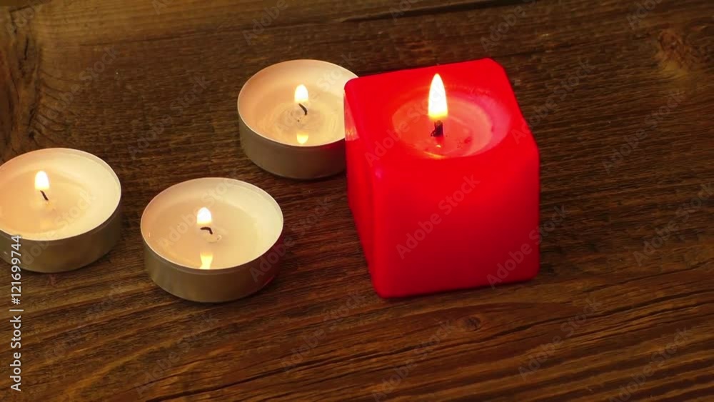 Group of burning candles on wooden background
Group of burning candles on wooden background