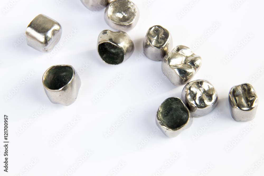 Dental metal tooth crowns on white background. Isolated. Dental metal tooth crowns on white background. Isolated.
