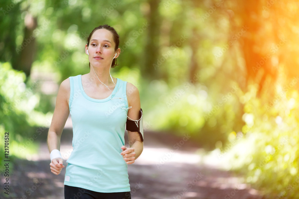 Young attractive woman running in the forest Young attractive woman running in the forest