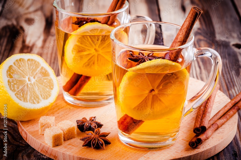 hot tea with lemon, anise and cinnamon in glass mugs hot tea with lemon, anise and cinnamon in glass mugs