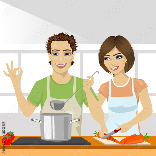 young couple cooking soup together in kitchen
