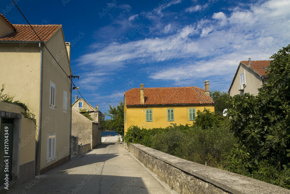 Yellow rustic house in Zlarin,Croatia