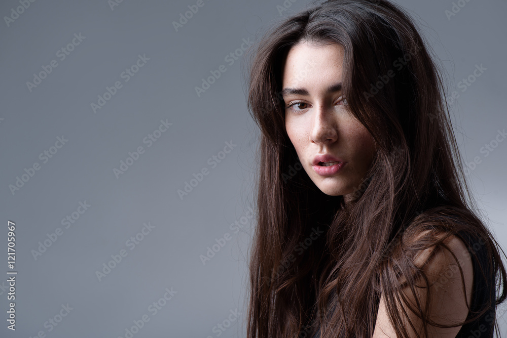 girl posing in the studio, isolated on light grey background girl posing in the studio, isolated on light grey background