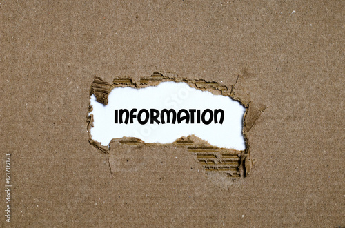 The word information appearing behind torn paper photo