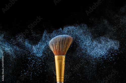 Brush with blue shadows shade on black background