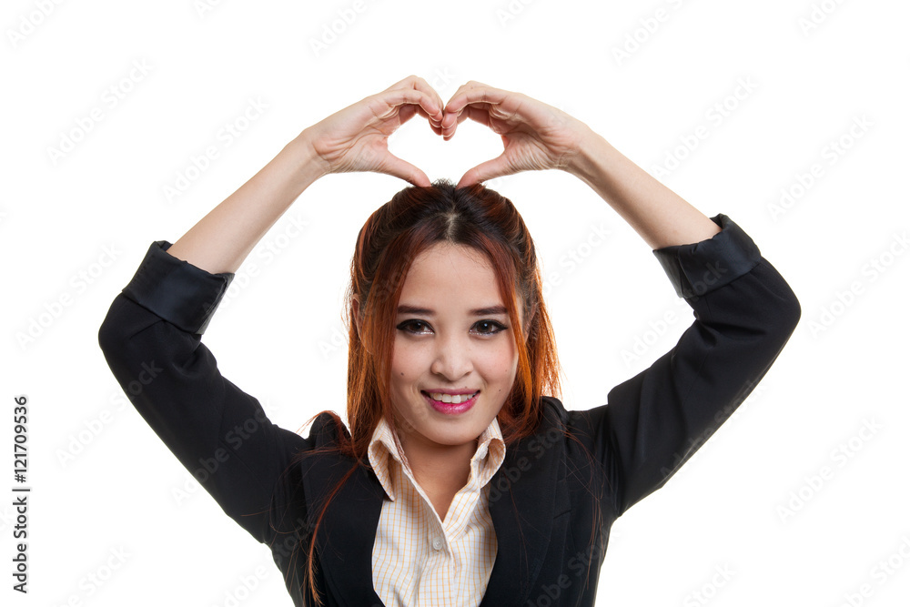 Young Asian woman gesturing heart hand sign. Young Asian woman gesturing heart hand sign.