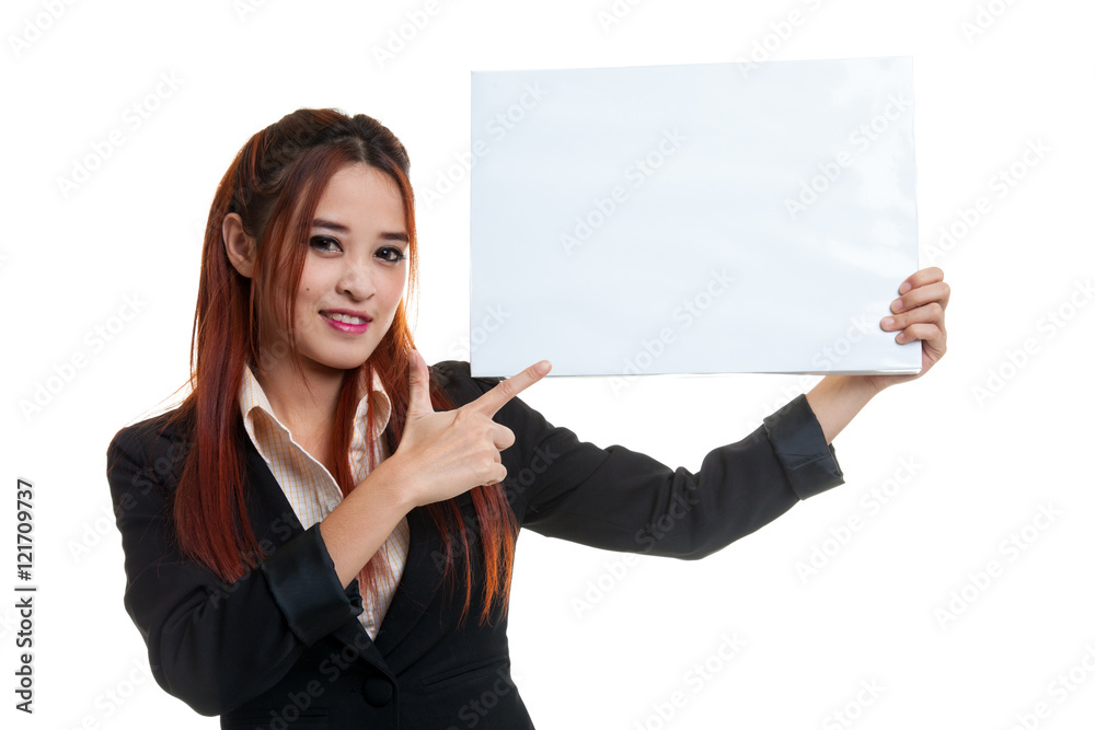 Young Asian business woman point to  blank sign.